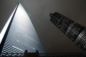 Skyscrapers loom above Shanghai. Urban gorwth in China is decreasing agricultura