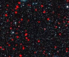 Wild early lives of today's most massive galaxies revealed