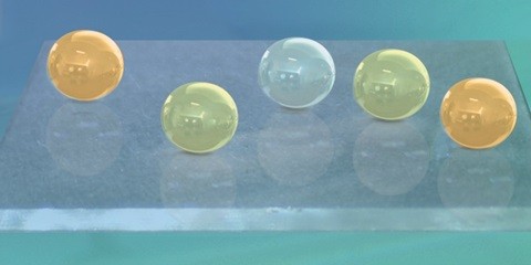 Oil droplets bead on a submerged glass surface. UAlberta researchers developed a