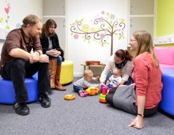 Parents and researchers in the Baby Lab with baby 