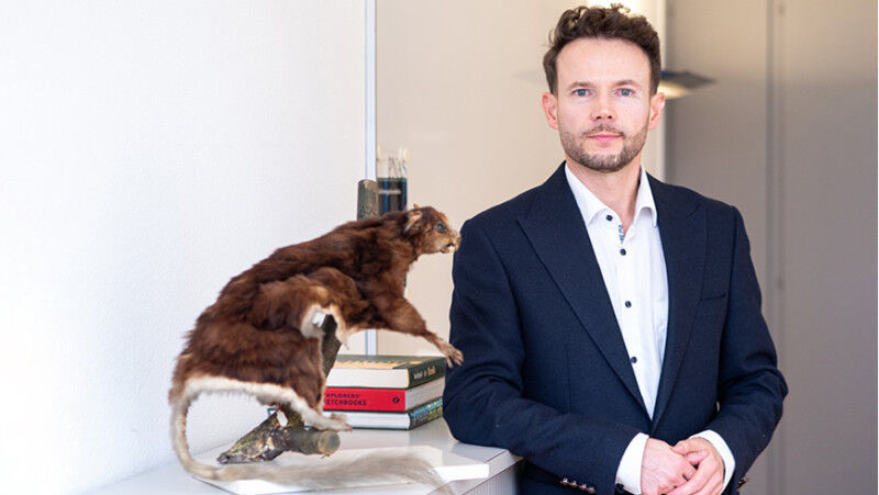 Ardian Jusufi with a museum specimen of the elusive Pel’s flying squirrel.