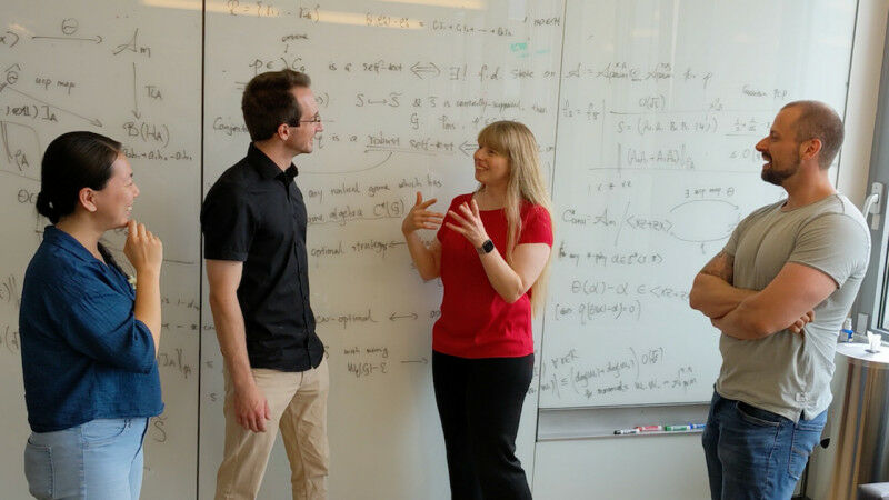Christine Muschik with researchers of the qudit quantum computer project