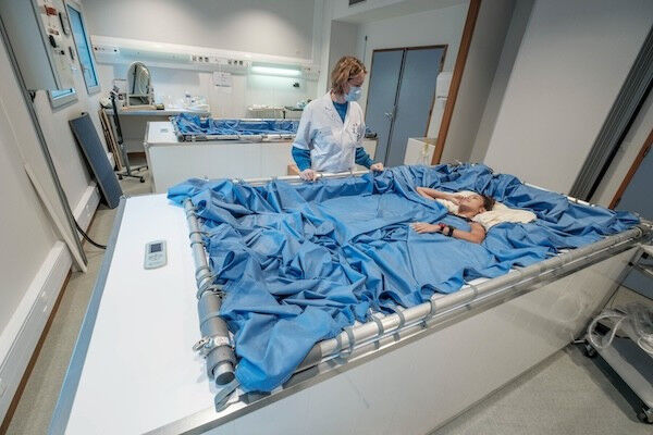 Astronomy & Space - Researchers from the European Space Agency SciSpacE team tending to participants of Vivaldi - an experiment investigating dry immersion as a technique for studying microgravity's impacts on the body. Astronomy & Space