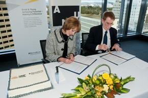 Lucille Halloran and Professor Ian Young sign the MoU. Photo by Stuart Hay
