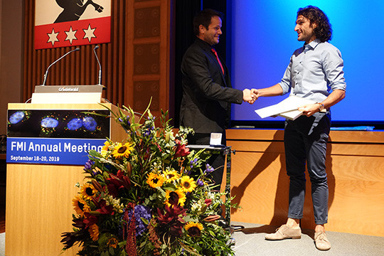 Paolo Capelli receiving his prize from group leader Georg Keller.     Below:  Al