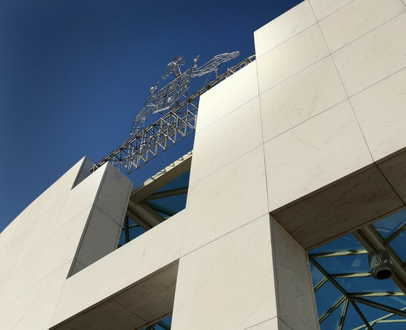 Low angle view of Australian coat of arms on Parliament House.