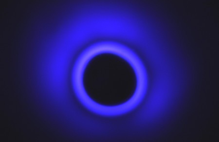 A torus of plasma, viewed from above. The ring is created by a jet of water stri