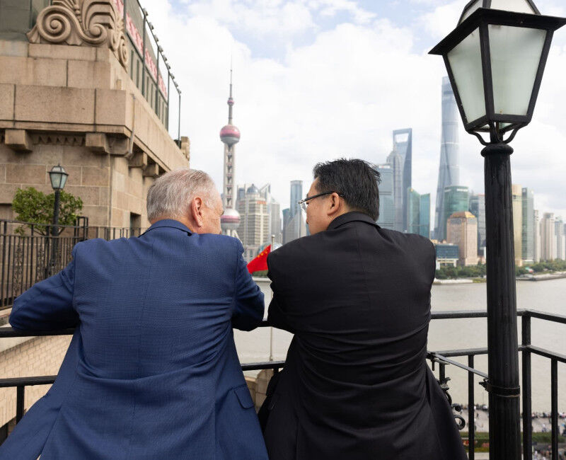 Minister for Trade, the Hon Don Farrell, talks with host in Shanghai. They are o
