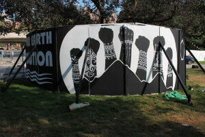 Indigenous artists transform tree protection hoardings outside Hart House into eye-catching murals