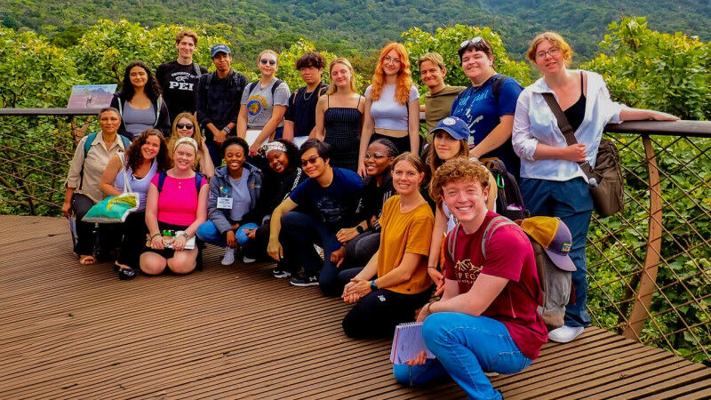 Indigenous students in a field study course in Cape Town, South Africa, posing f