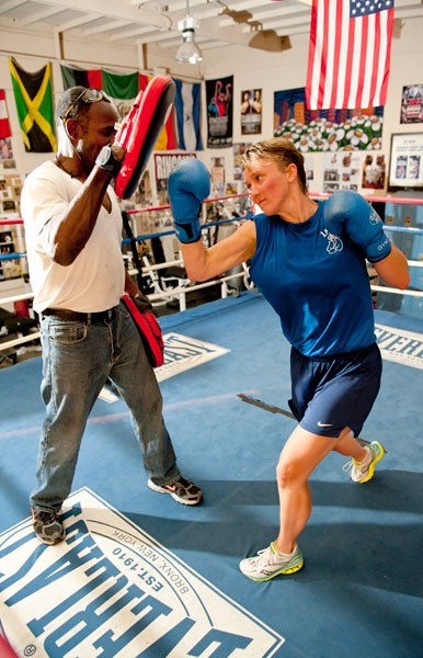 Graduate student Friederike Knupling spars with Mike Francois at the East Palo A