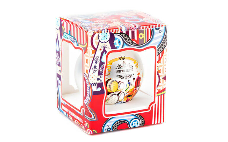 A festive bauble in colourful packaging