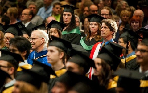 James Balog makes his way to the convocation stage to receive an honorary doctor