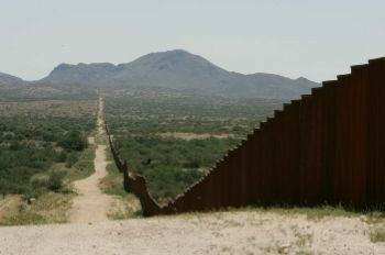 Border barriers, such as this along the USA-Mexico border, present an obstacle f