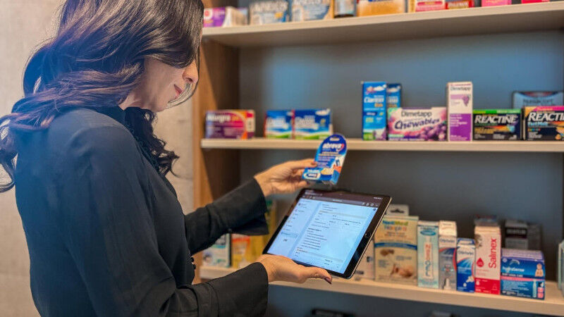 Nardine Nakhla holding a tablet and cross referencing medication with MAPflow da