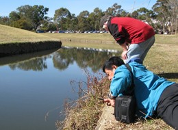 Dr Paul Cooper and Dr Thanit Pewnim collect data at Sullivans Creek. Photo by Wa