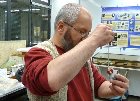 Mineralogist Stefan Nicolescu demonstrating the meteorite&rsquo;s magnetic field