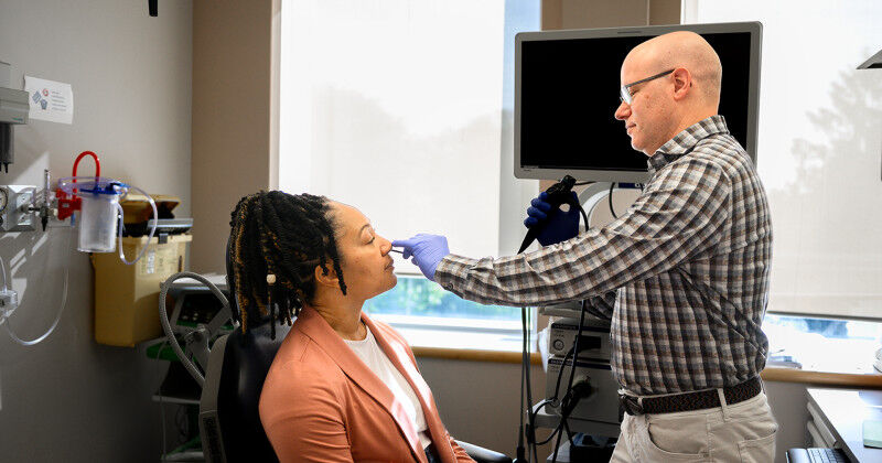 Brian Rotenberg (right) demonstrating the use of a nasal endoscopy. A new study 