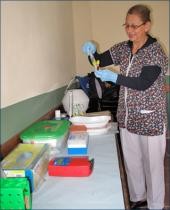 A nurse on Kordas' research team, Delma Ribeiro, gets ready to separate ser