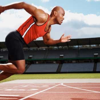An athlete training on a running track.