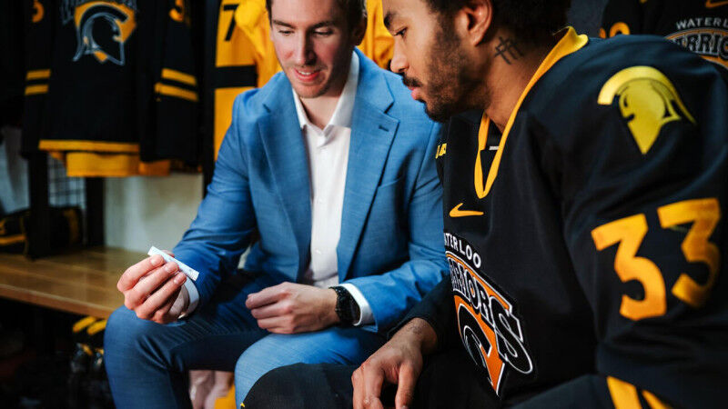 Andrew Cordssen-David showing a HeadFirst assessment test to a Waterloo Varsity