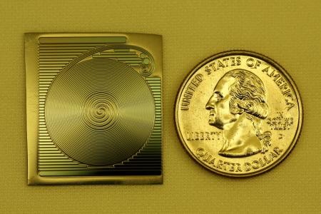 A photograph of the 1.2 meter spiral chip-based resonator developed at Caltech, 