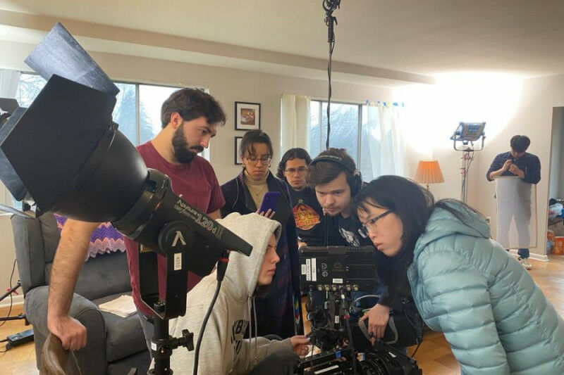 A Studio North crew crowded around the camera’s monitor