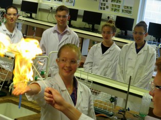 Supported Progression students watch an experiment in a Durham University Chemis