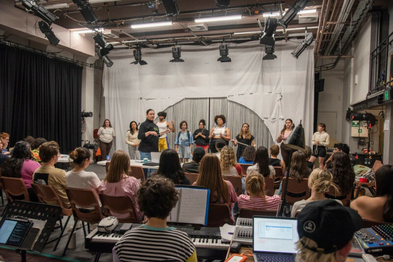 Students watch on as the Flat Earthers cast and creative team rehearse. Photo: G