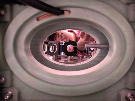 Kon H. Leung is seen here working on the apparatus used to trap 6,100 atoms. Cre