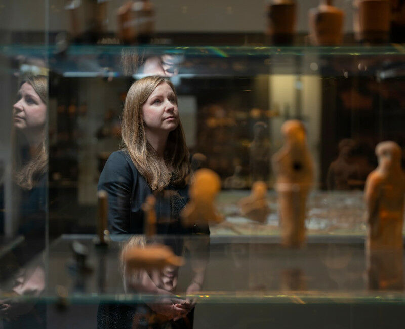 Georgia Pike-Rowney looks at ancient figures and statues displayed within the AN
