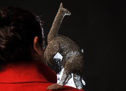 Ximena Briceno and her filigree artwork.