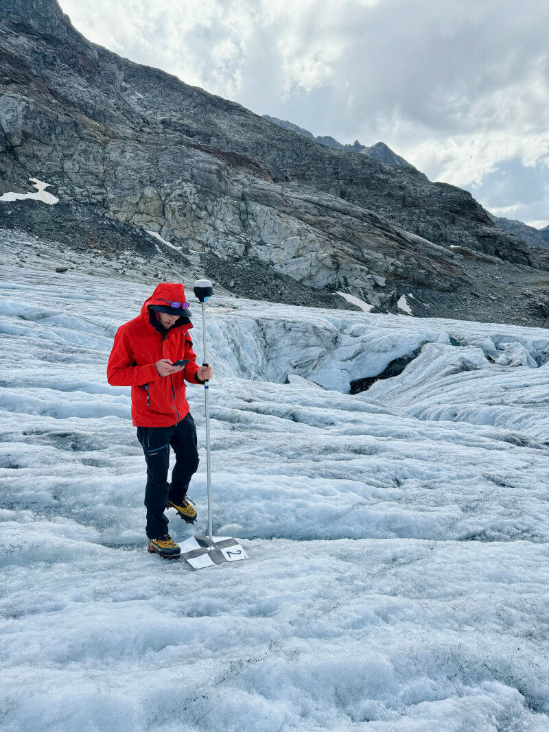 SLF researcher Maximilian Sesselmann taking measurements on the Silvretta glacie