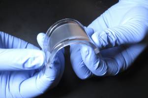 Thin, flexible device could provide efficient cooling for mobile electronics - or people
