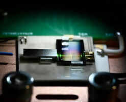 Topological Solitons Power a Chip-Scale Frequency Comb Source