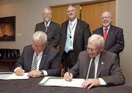 Signing the agreement are (front row) ANU Vice-Chancellor Professor Ian Chubb an