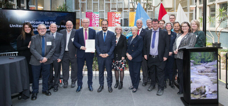 The UNU Hub Founding Fellows and Research Cluster leads pose for a photo with le