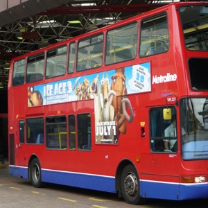 London bus with &rsquo;T-side&rsquo; advertisement at London Bridge station (cre