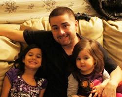 UCSD student Jorge Narvaez poses with daughters Alexa and Eliana.